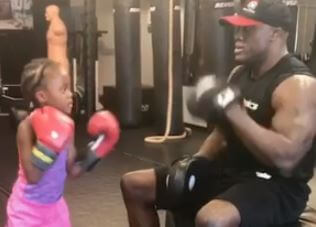 Bobby Lashley training his daughter Naomi Lashley.